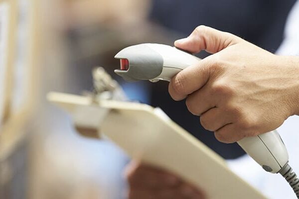 Warehousing & vendor managed inventory employee using a scanner to track inventory